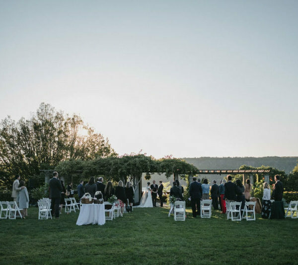 Socially distanced guests at an outdoor wedding